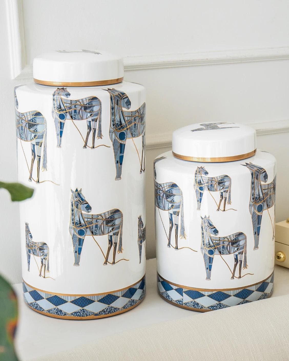 Eloisa Bundle canisters in white and blue, shown in a lifestyle left view as image 2