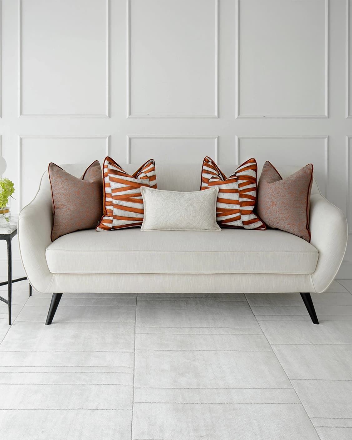 Topaz Bundle cushion in orange, white and red, shown in a lifestyle front view as image 4