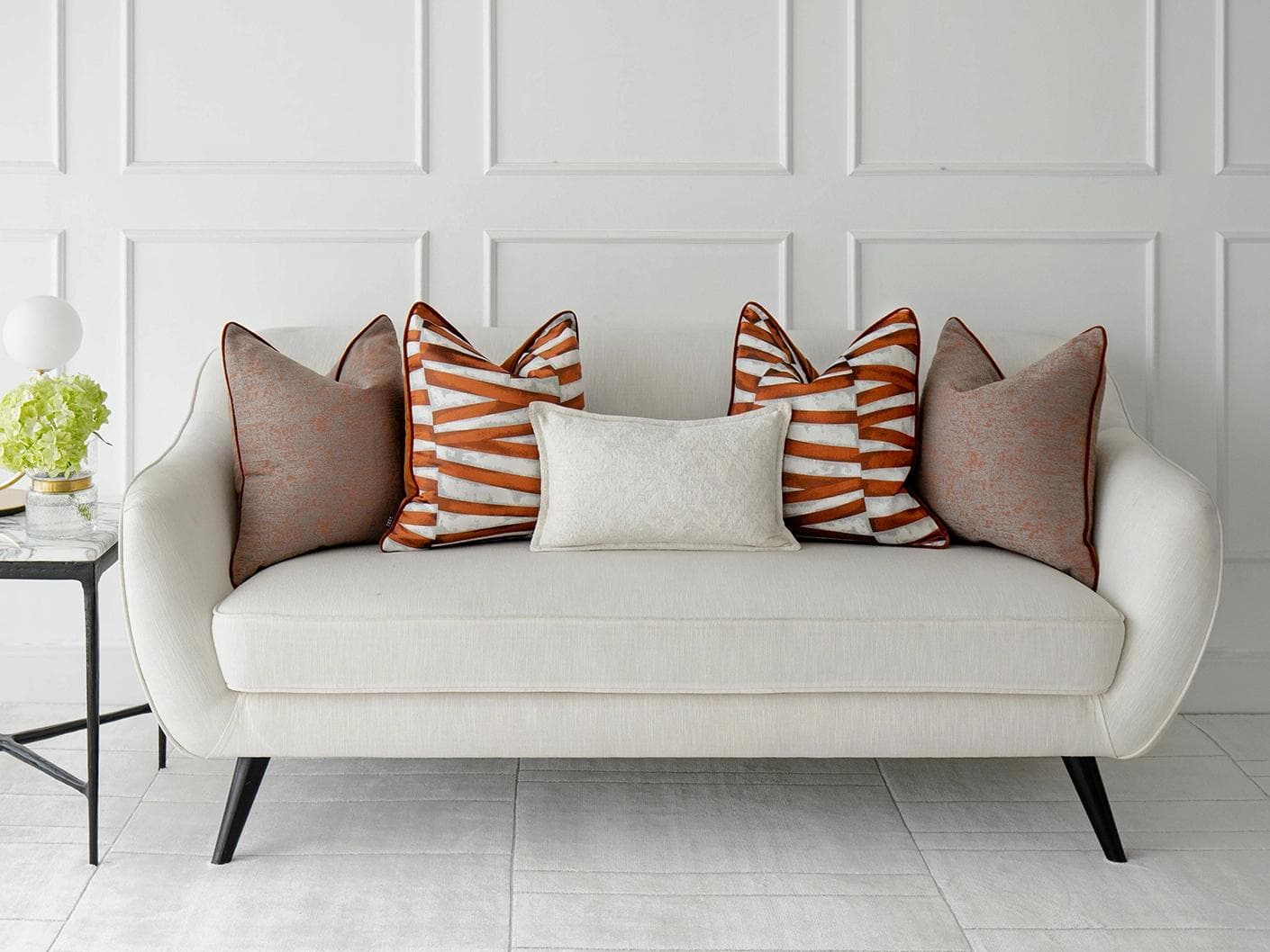 Topaz Bundle cushion in orange, white and red, shown in a lifestyle front view as image 4