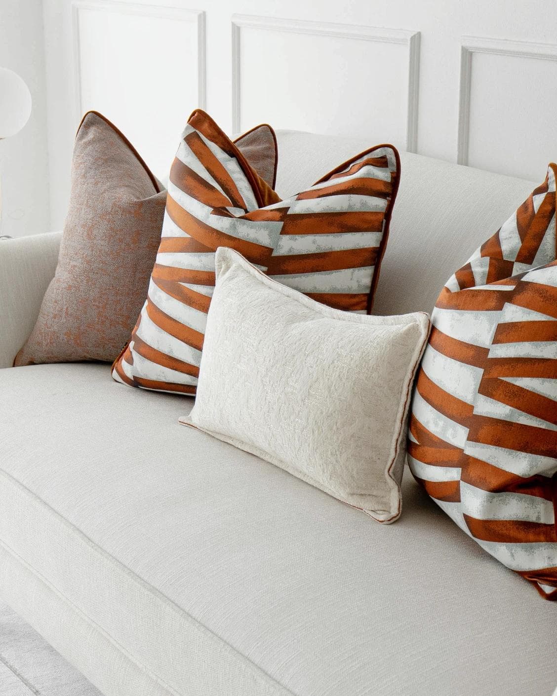 Topaz Bundle cushion in orange, white and red, shown in a product right view as image 5