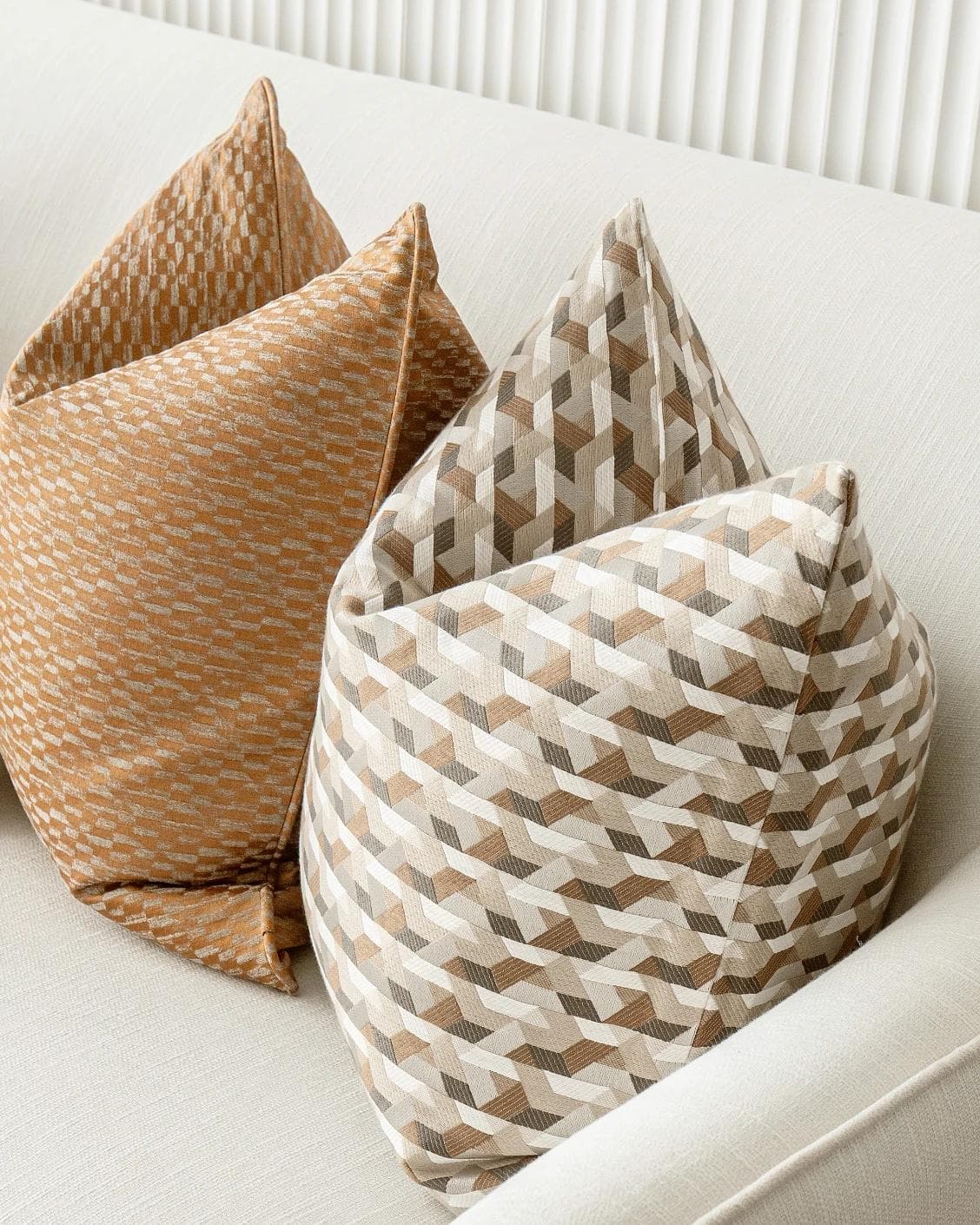 Nerola Bundle cushion in orange, beige and white, shown in a product right view as image 9