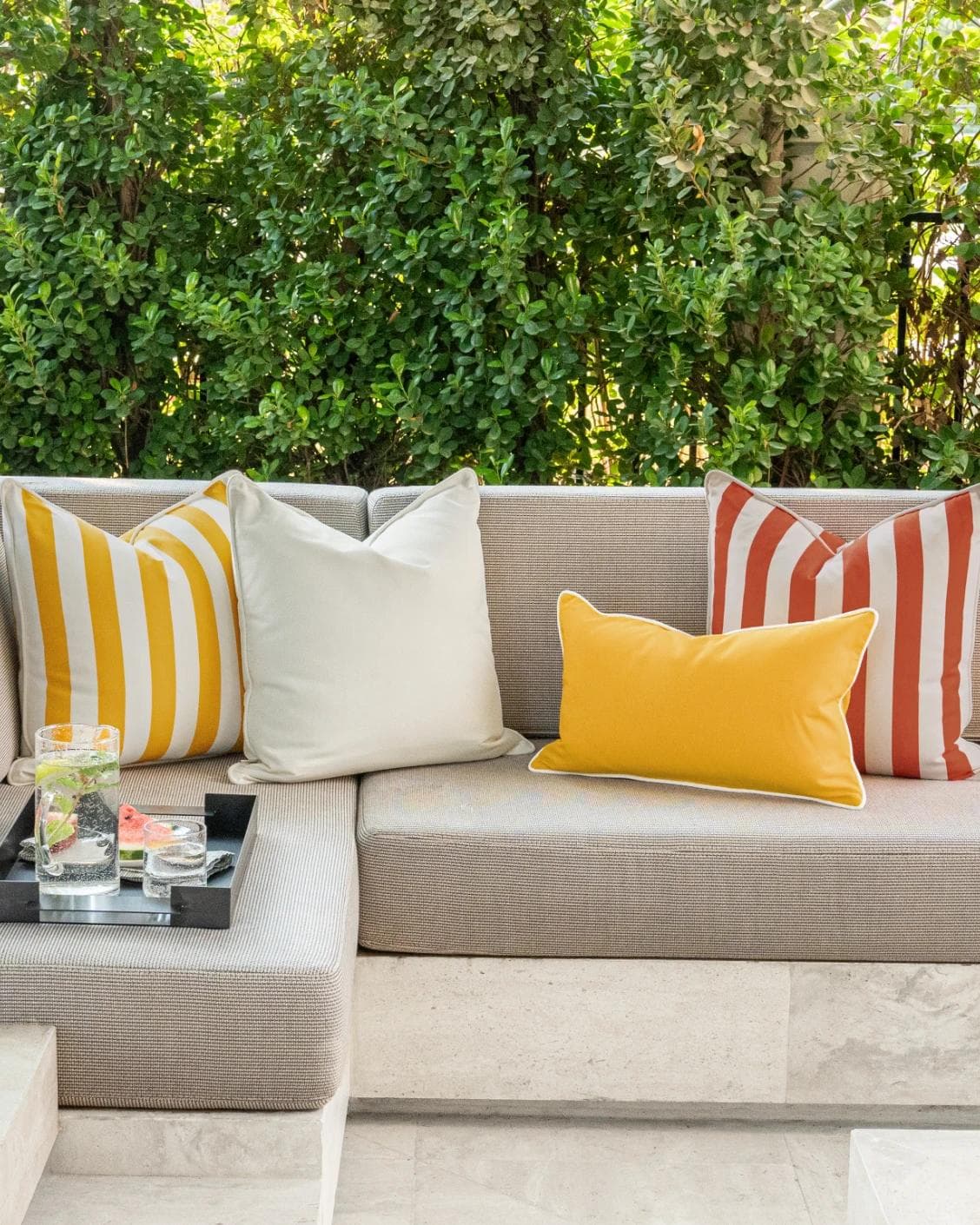Aarush Bundle cushion in orange, yellow and ivory, shown in a lifestyle front view as image 4