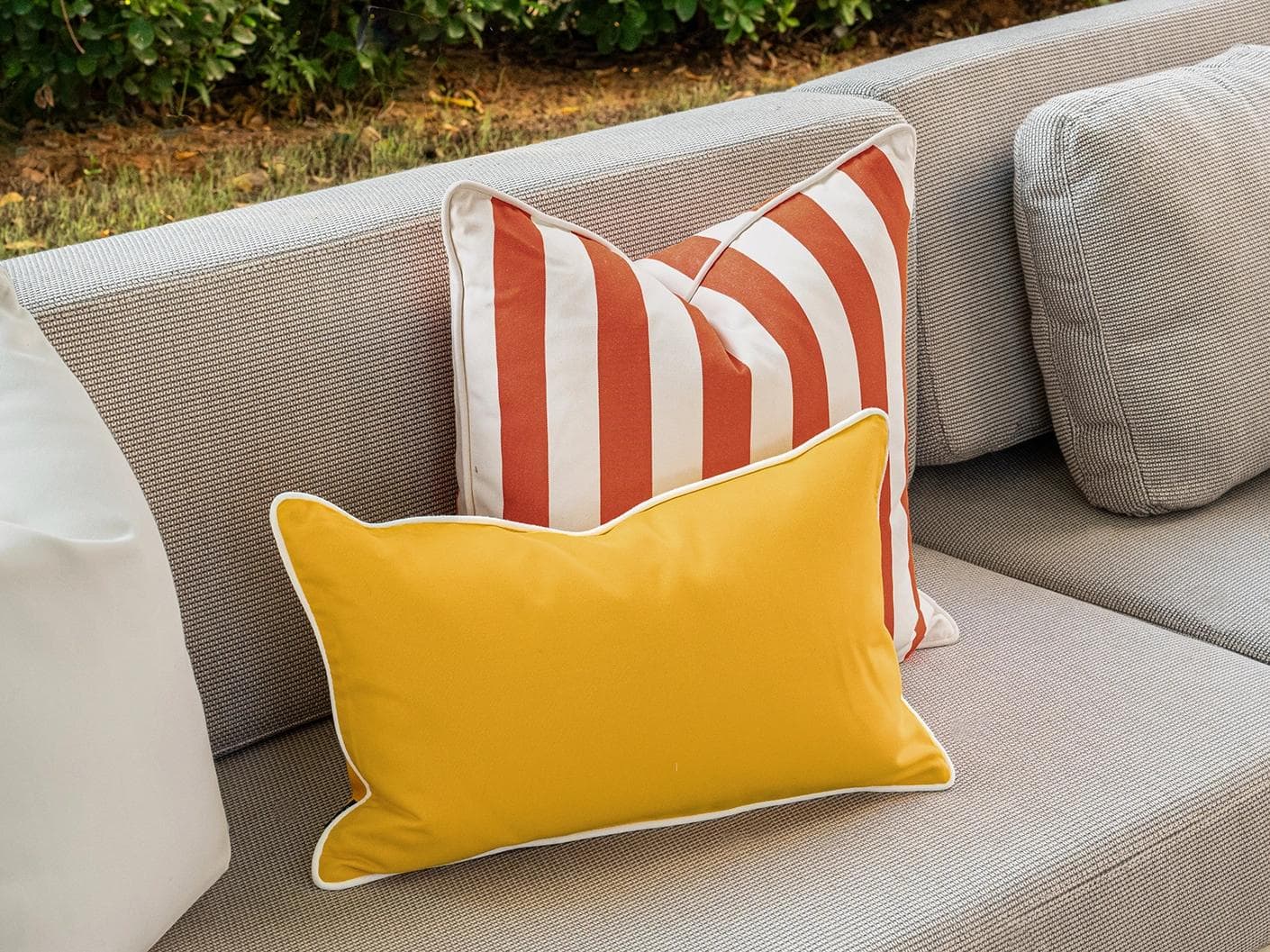 Aarush Bundle cushion in orange, yellow and ivory, shown in a lifestyle left view as image 5