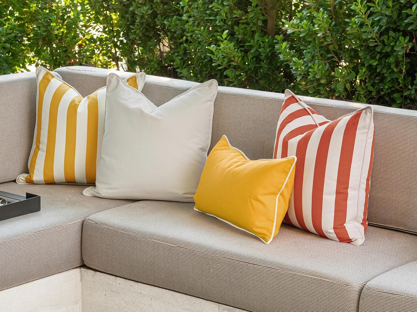Aarush Bundle cushion in orange, yellow and ivory, shown in a lifestyle right view as image 2
