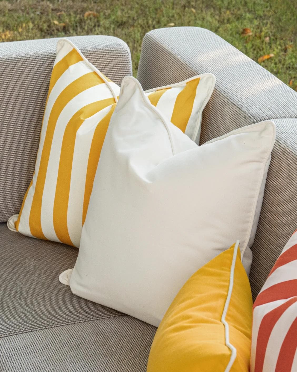 Aarush Bundle cushion in orange, yellow and ivory, shown in a lifestyle right view as image 7