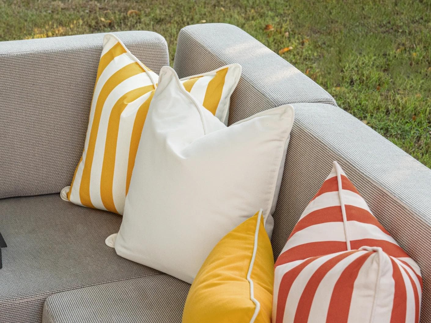 Aarush Bundle cushion in orange, yellow and ivory, shown in a lifestyle right view as image 7