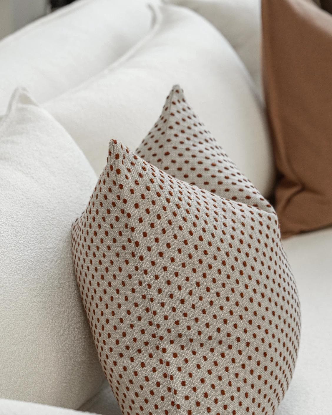 Abhishek Bundle cushion in brown and rust, shown in a product left view as image 7