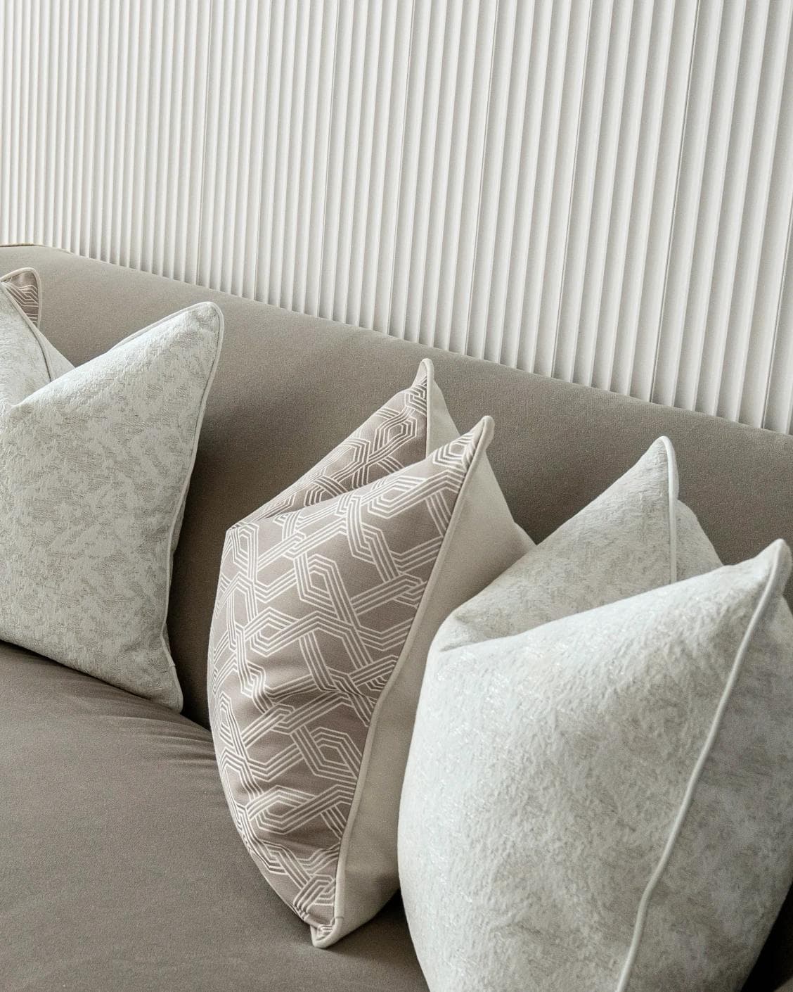 Alicia Bundle cushion in white and beige, shown in a lifestyle right view as image 5