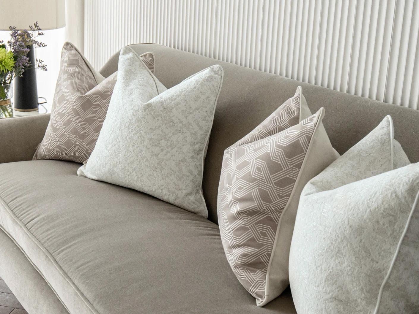 Alicia Bundle cushion in white and beige, shown in a lifestyle right view as image 5