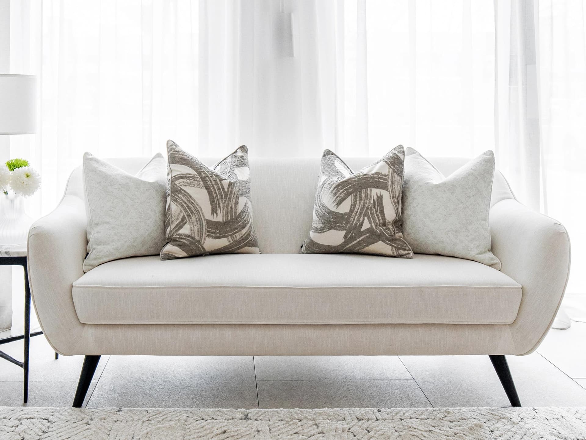 Gianna Bundle cushion in white and grey, shown in a lifestyle front view as image 6