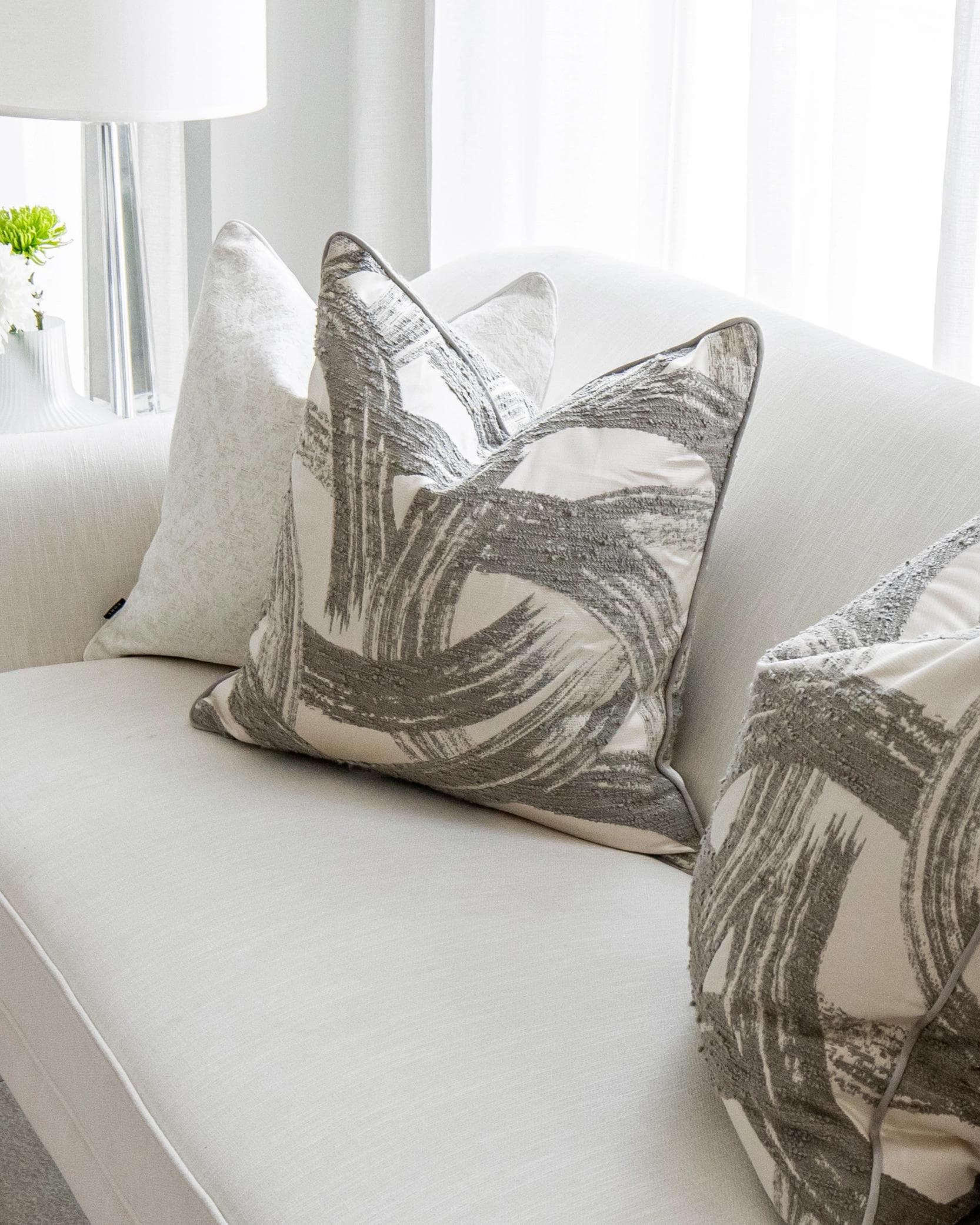 Gianna Bundle cushion in white and grey, shown in a lifestyle right view as image 7