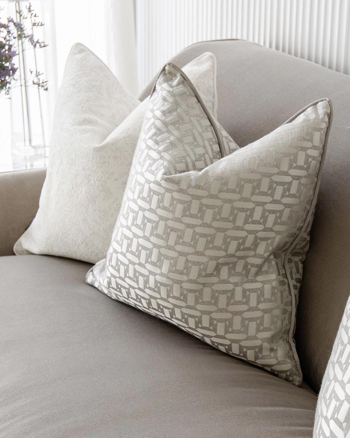 Nadia Bundle cushion in white, beige and silver, shown in a lifestyle right view as image 5
