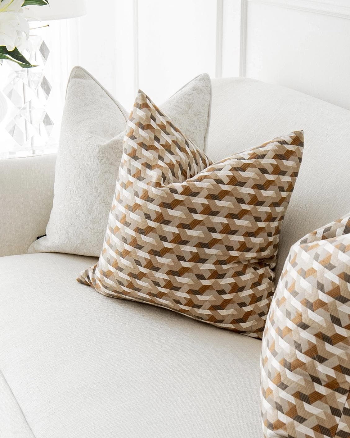 Lorraine Bundle cushion in white, orange and beige, shown in a lifestyle right view as image 5