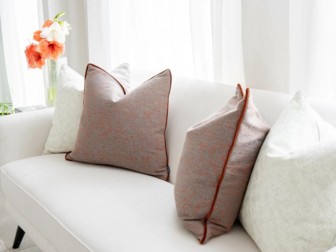 Cassie Bundle cushion in orange, white and red, shown in a lifestyle right view as image 4