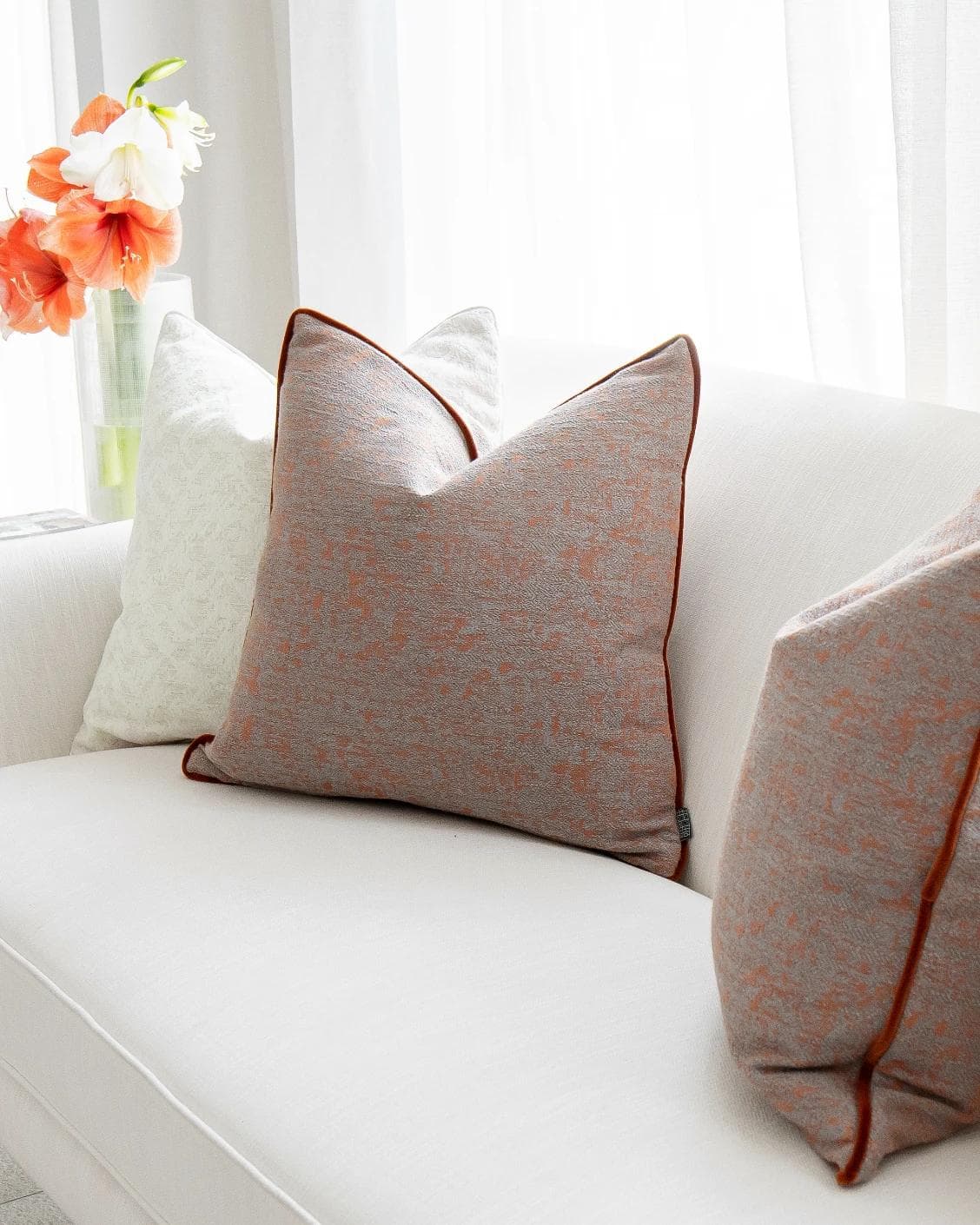 Cassie Bundle cushion in orange, white and red, shown in a lifestyle right view as image 4
