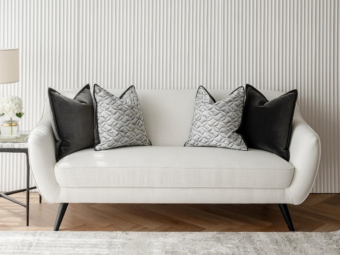 Adham Bundle cushion in black, grey and white, shown in a lifestyle front view as image 4