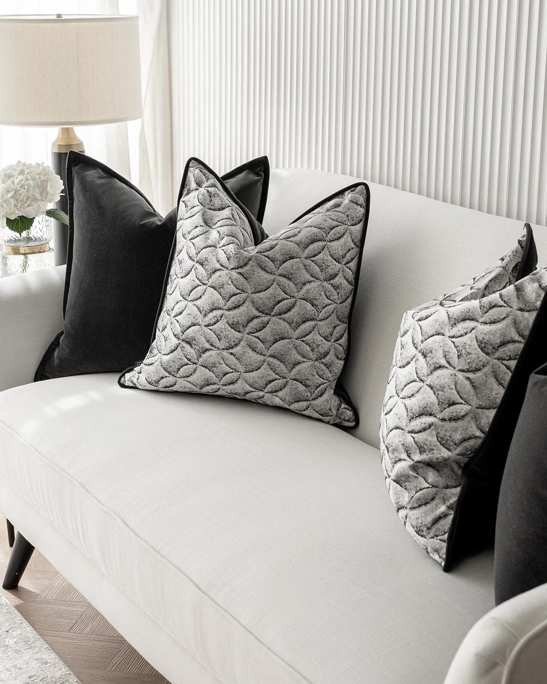 Adham Bundle cushion in black, grey and white, shown in a lifestyle right view as image 5