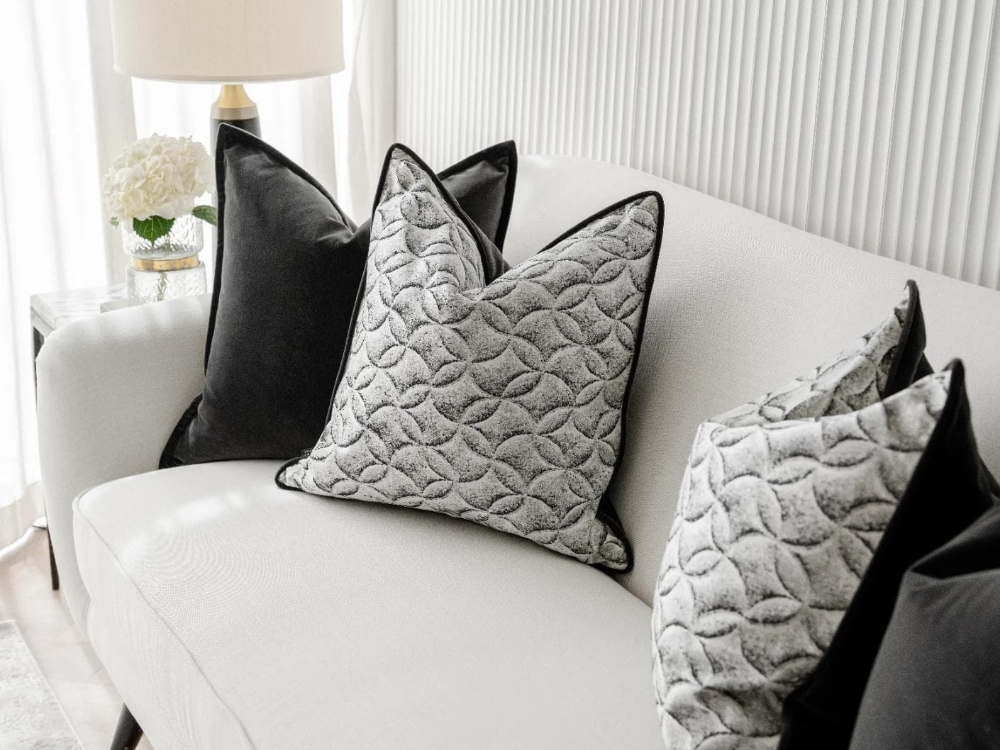 Adham Bundle cushion in black, grey and white, shown in a lifestyle right view as image 6