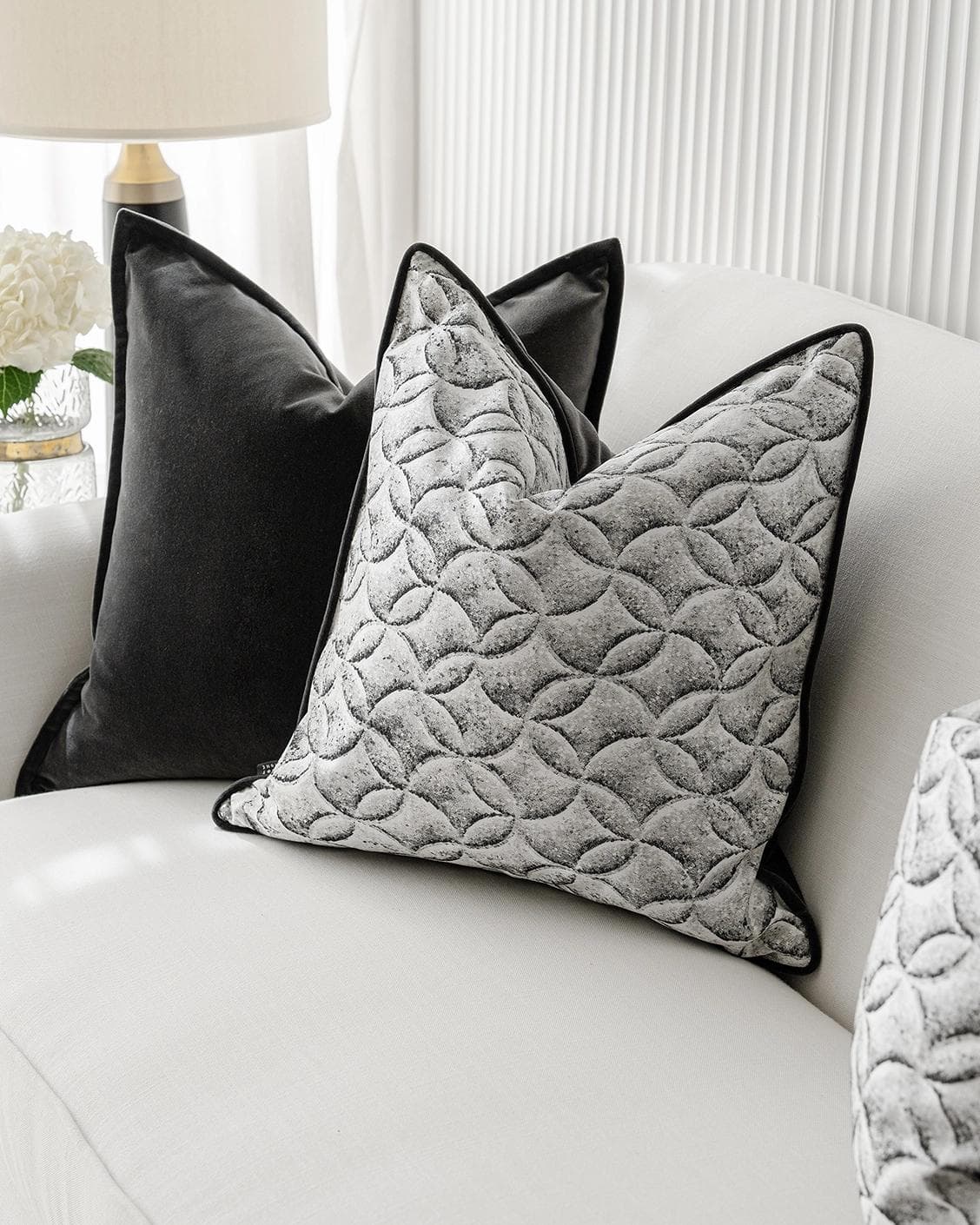 Adham Bundle cushion in black, grey and white, shown in a lifestyle right view as image 6
