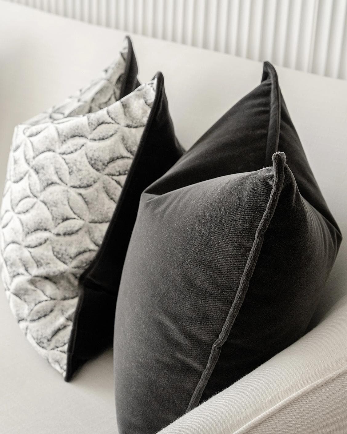 Adham Bundle cushion in black, grey and white, shown in a lifestyle right view as image 7