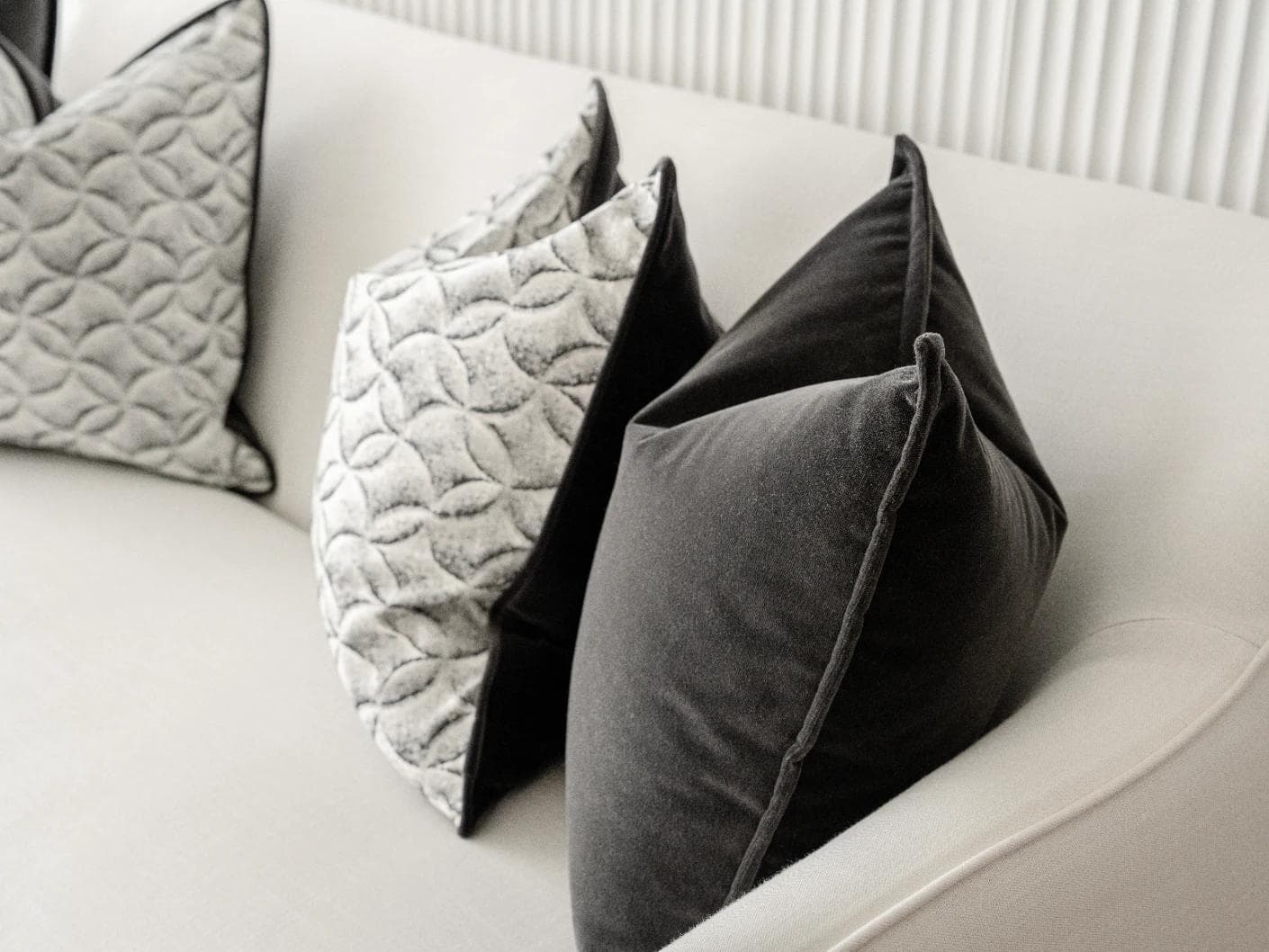 Adham Bundle cushion in black, grey and white, shown in a lifestyle right view as image 7