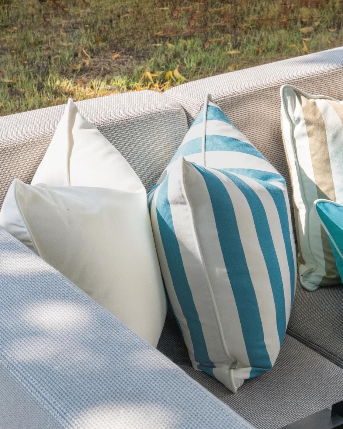 Aditya Bundle cushion in turquoise, beige and ivory, shown in a lifestyle left view as image 5