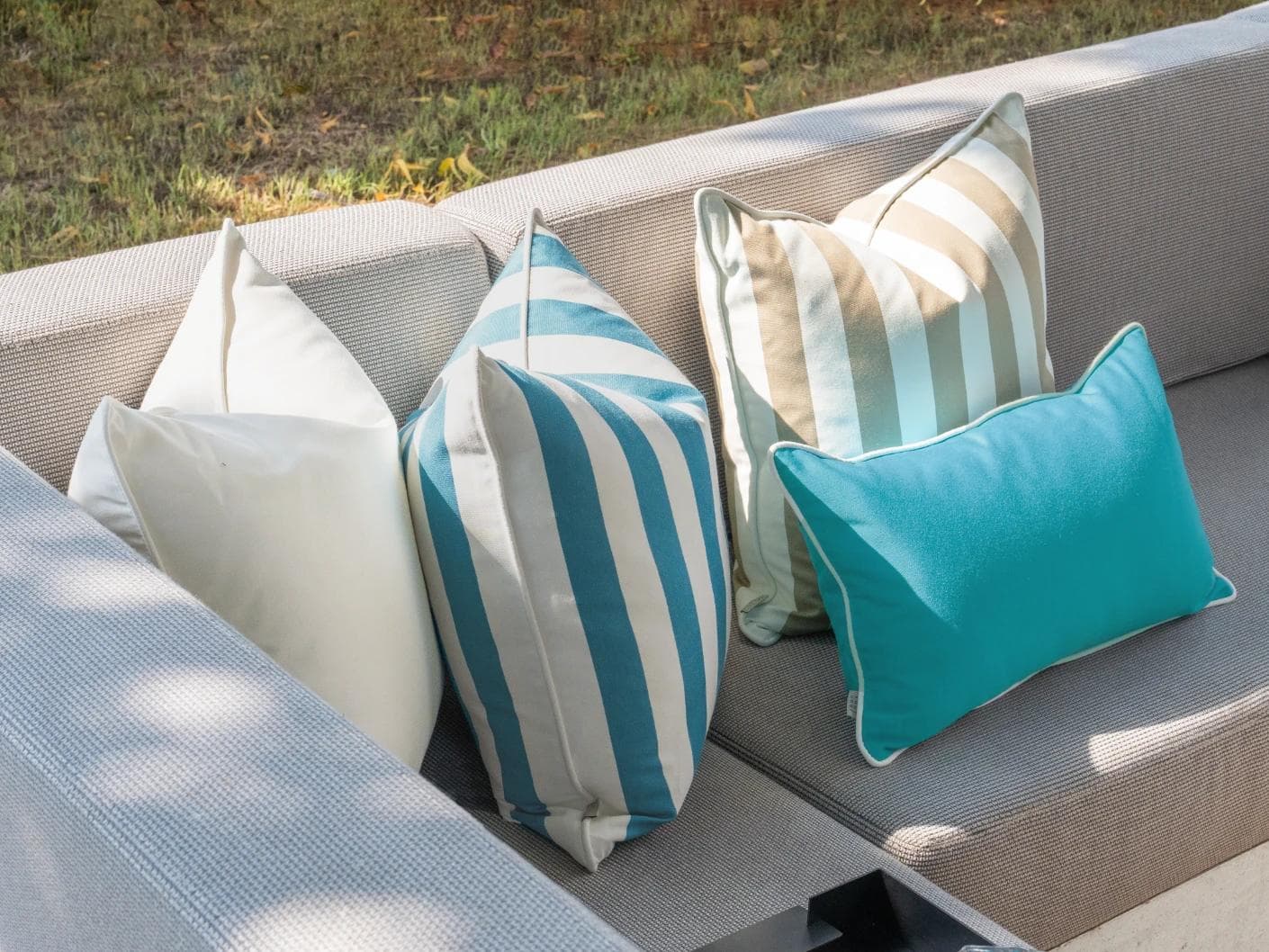 Aditya Bundle cushion in turquoise, beige and ivory, shown in a lifestyle left view as image 5