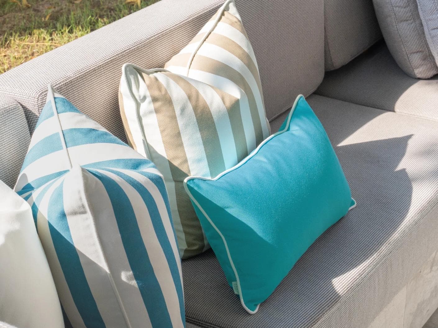 Aditya Bundle cushion in turquoise, beige and ivory, shown in a lifestyle left view as image 6