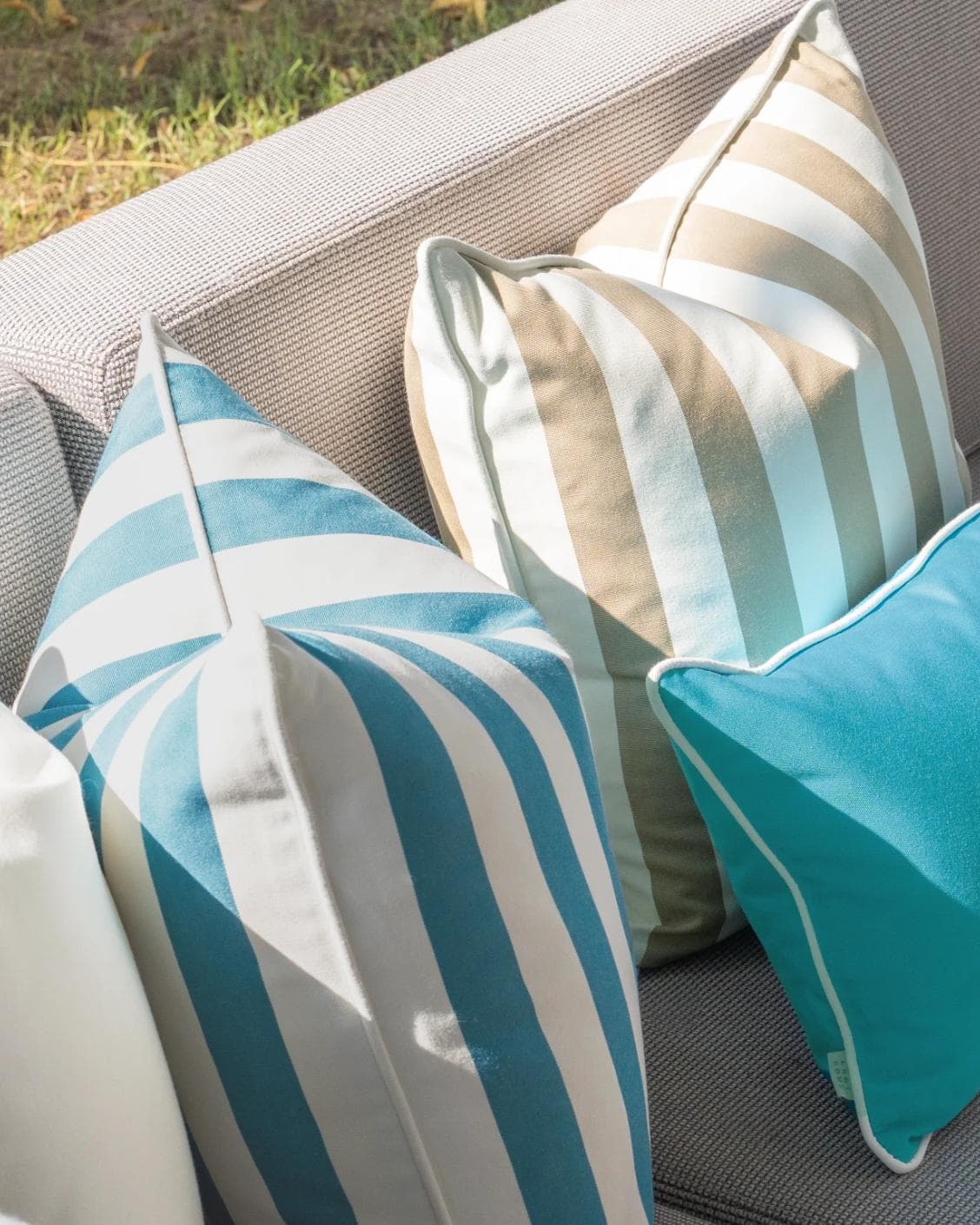 Aditya Bundle cushion in turquoise, beige and ivory, shown in a lifestyle left view as image 6