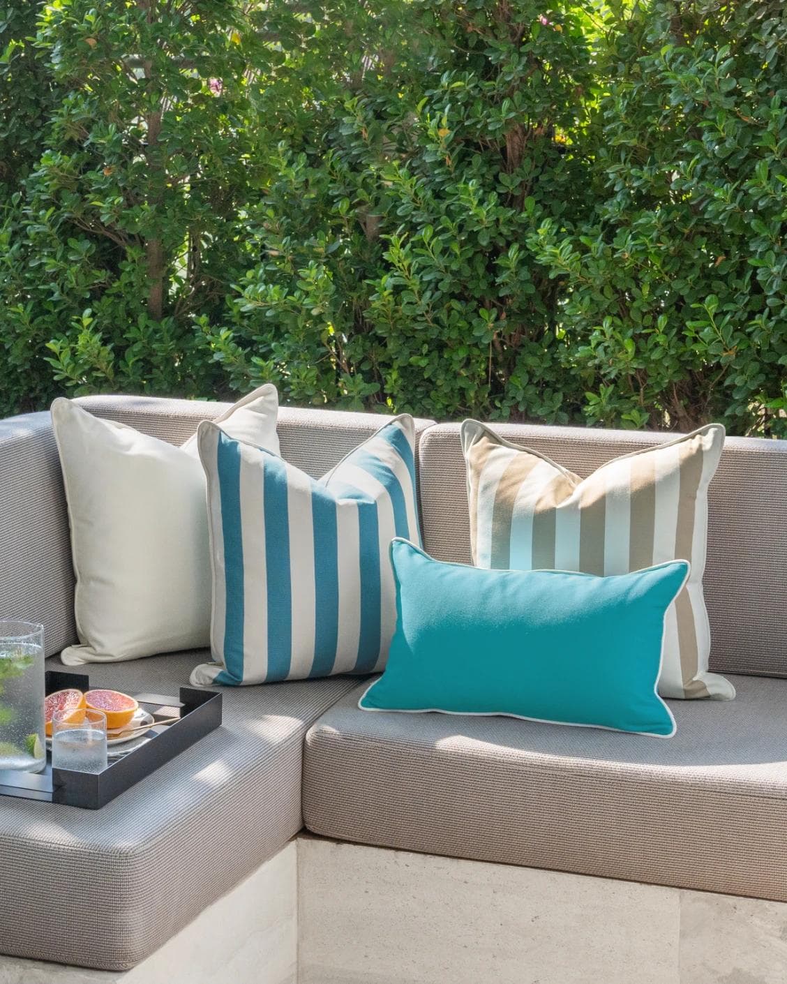 Aditya Bundle cushion in turquoise, beige and ivory, shown in a lifestyle right view as image 2