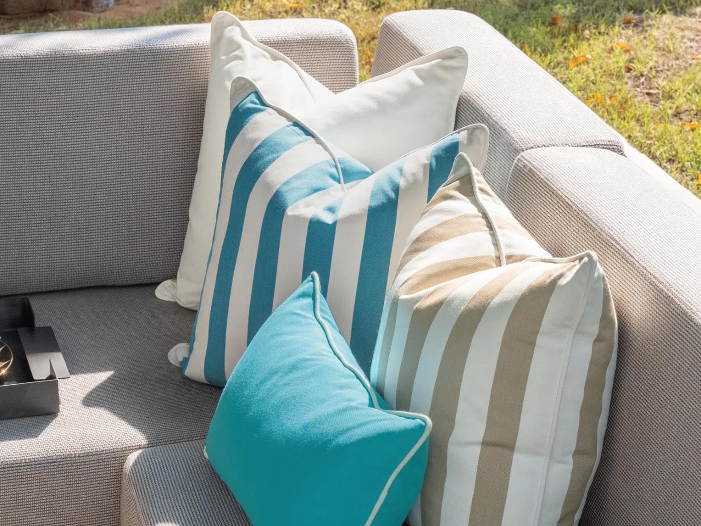Aditya Bundle cushion in turquoise, beige and ivory, shown in a lifestyle right view as image 7