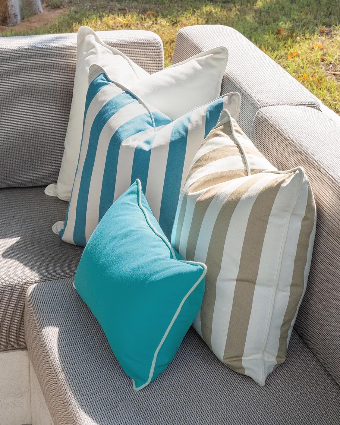 Aditya Bundle cushion in turquoise, beige and ivory, shown in a lifestyle right view as image 7