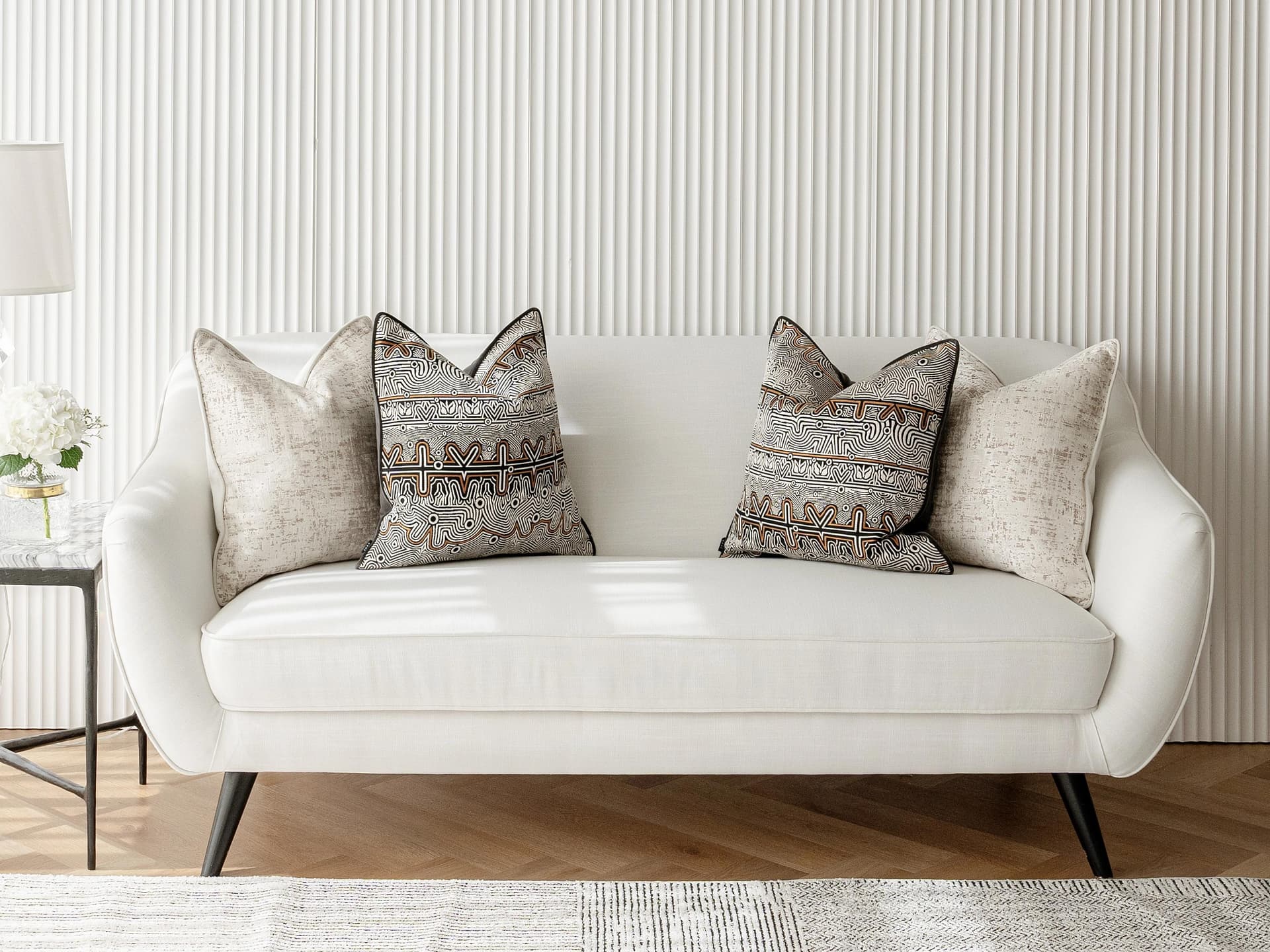 Adonis Bundle cushion in white, black and silver, shown in a lifestyle front view as image 4