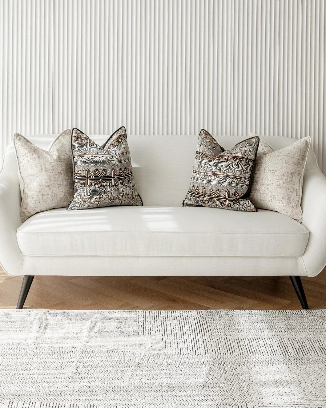 Adonis Bundle cushion in white, black and silver, shown in a lifestyle front view as image 4