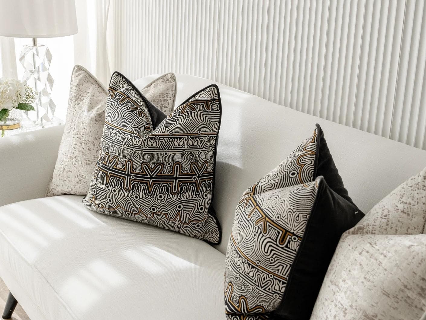 Adonis Bundle cushion in white, black and silver, shown in a lifestyle right view as image 5
