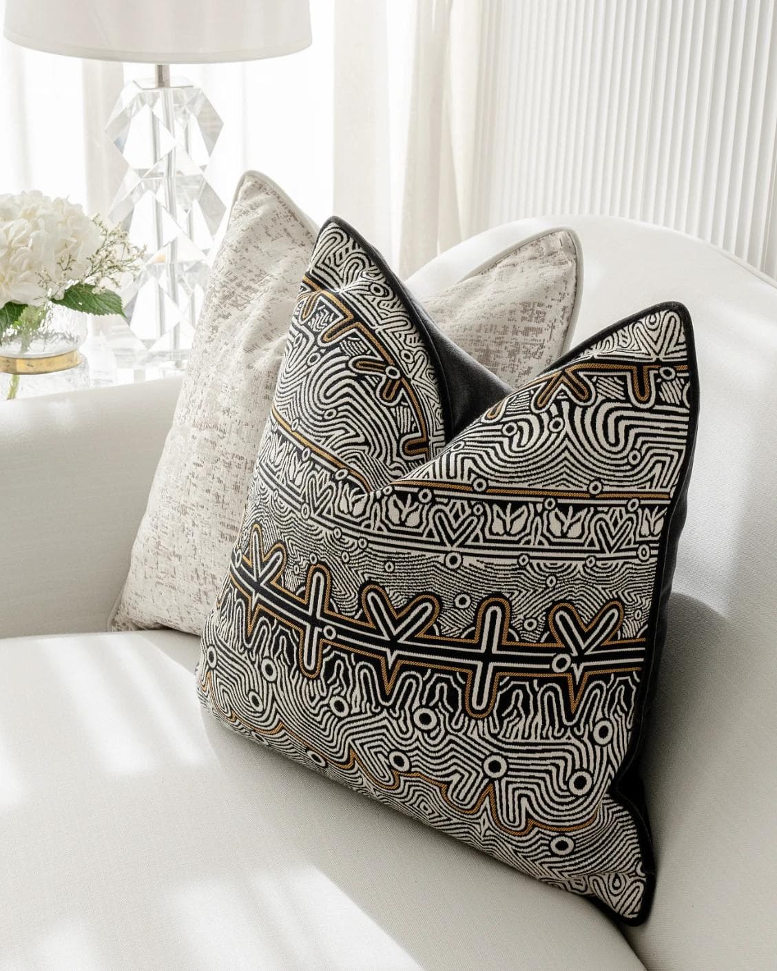 Adonis Bundle cushion in white, black and silver, shown in a lifestyle right view as image 6