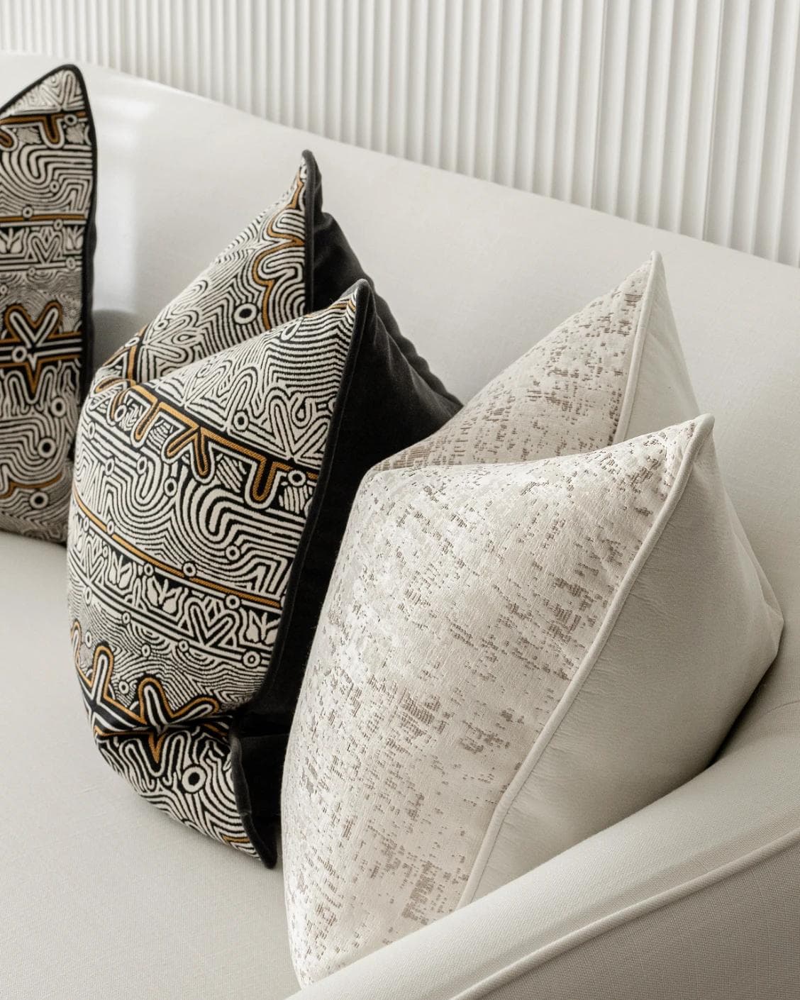 Adonis Bundle cushion in white, black and silver, shown in a lifestyle right view as image 7