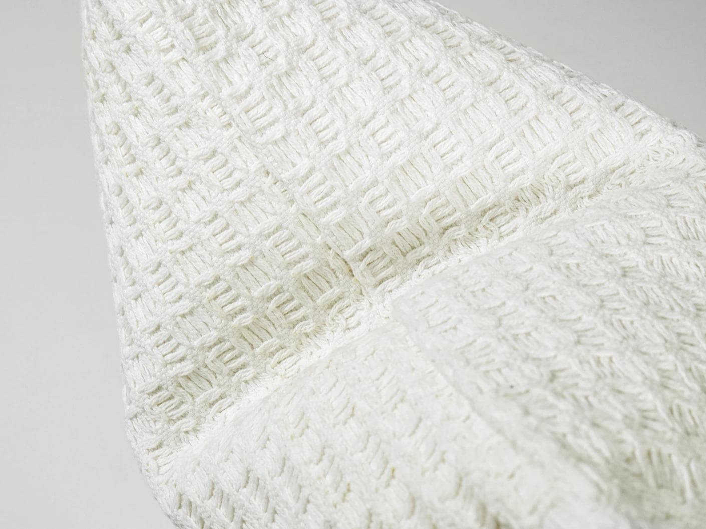 Adora Bianca cushion in white, shown in a product close-up as image 9
