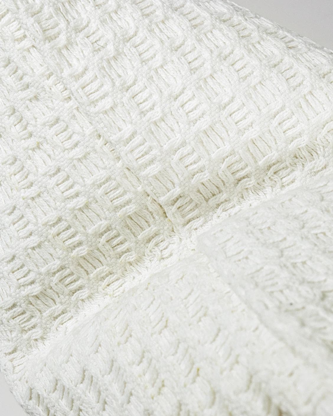 Adora Bianca cushion in white, shown in a product close-up as image 9
