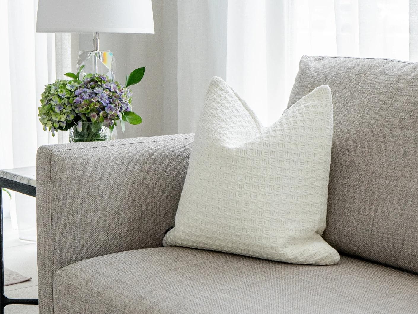 Adora Bianca cushion in white, shown in a product as image 2