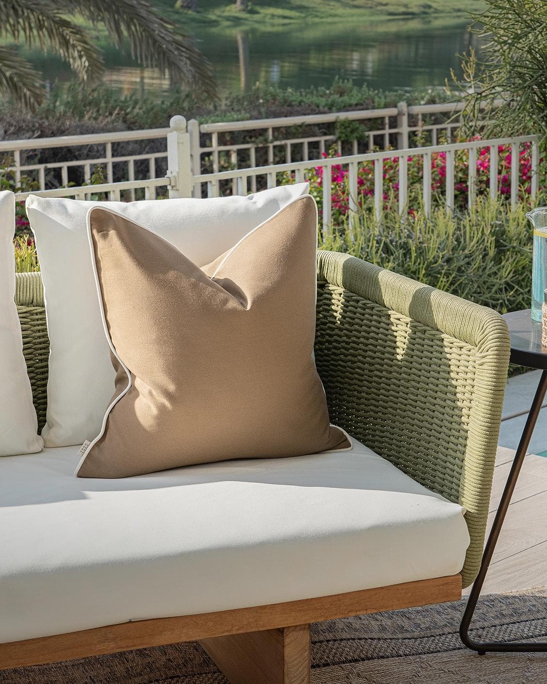 Aelia Braun cushion in brown, shown in a lifestyle left view as image 2