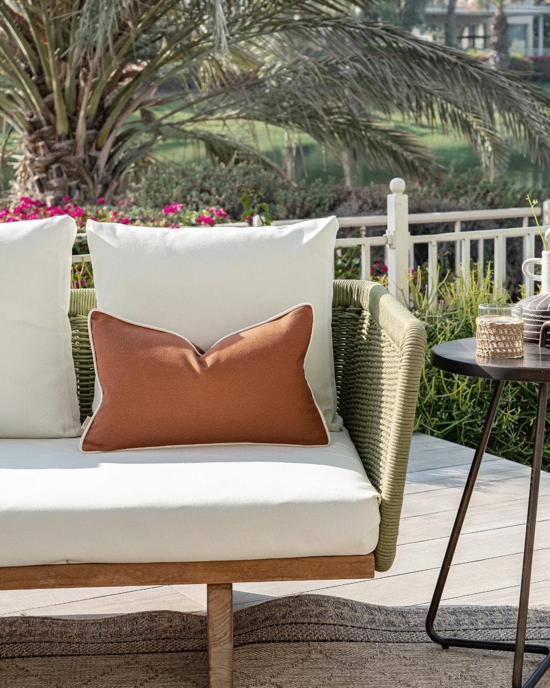 Aelia Clay II cushion in rust, shown in a lifestyle front view as image 4