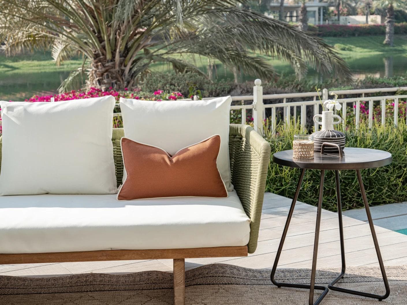 Aelia Clay II cushion in rust, shown in a lifestyle front view as image 4