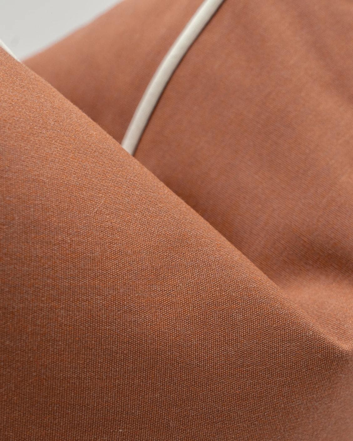 Aelia Clay II cushion in rust, shown in a product close-up as image 7