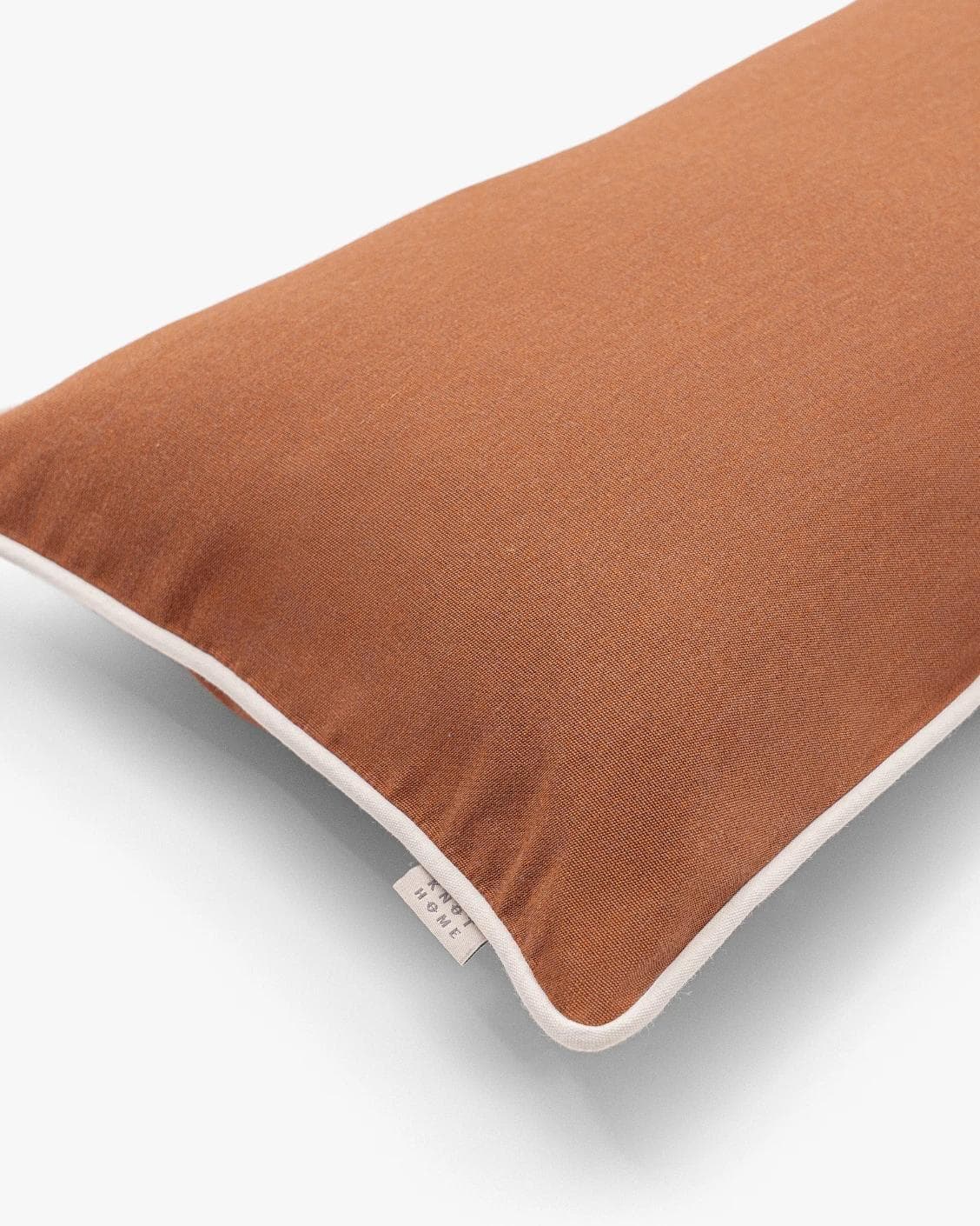 Aelia Clay II cushion in rust, shown in a product top view as image 9