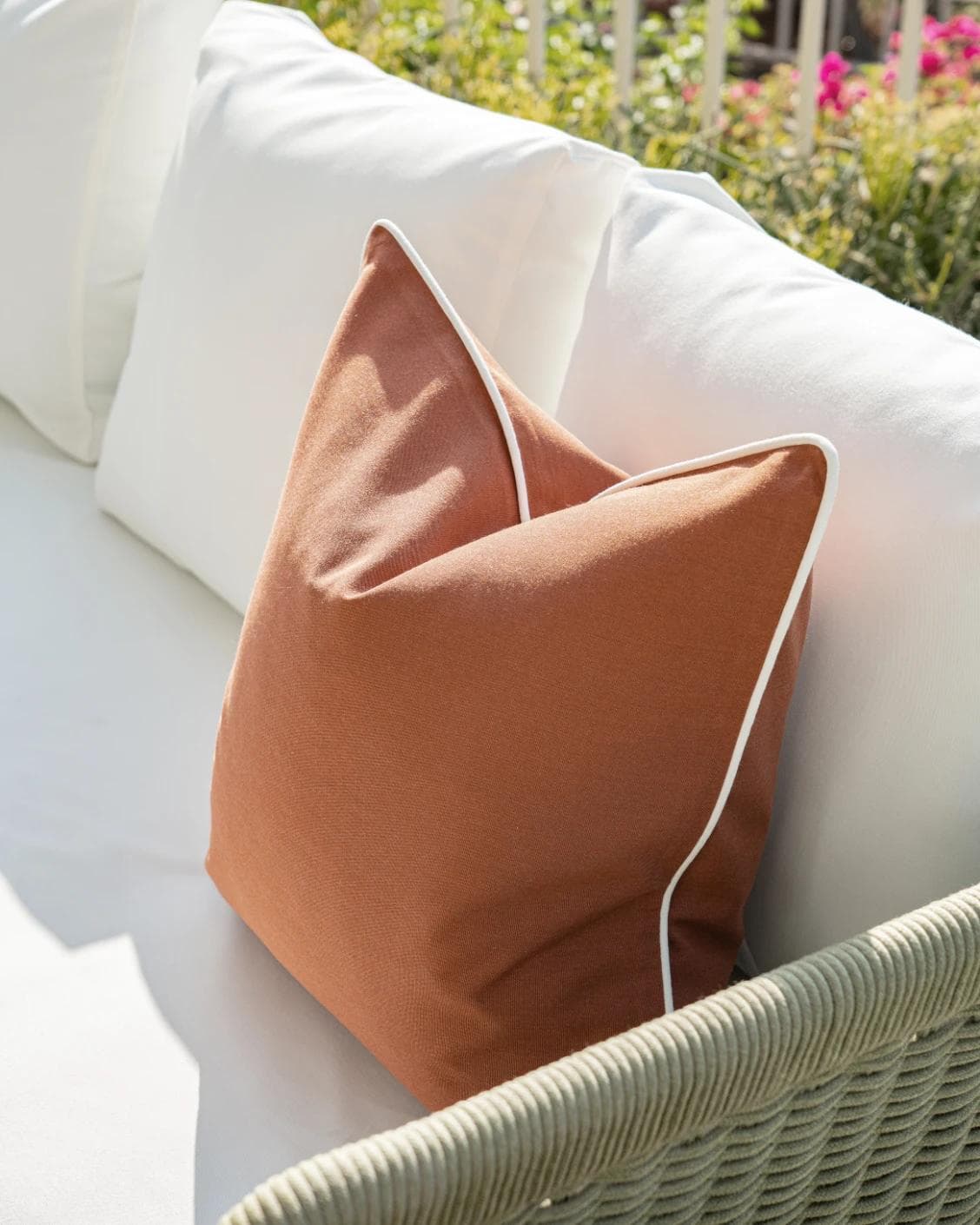 Aelia Clay cushion in rust, shown in a lifestyle right view as image 4
