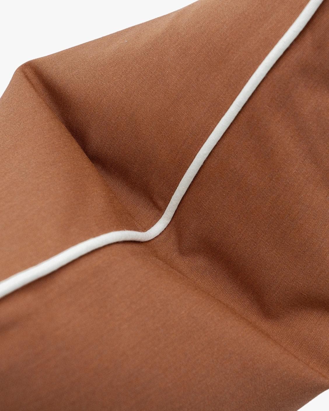 Aelia Clay cushion in rust, shown in a product top view as image 10