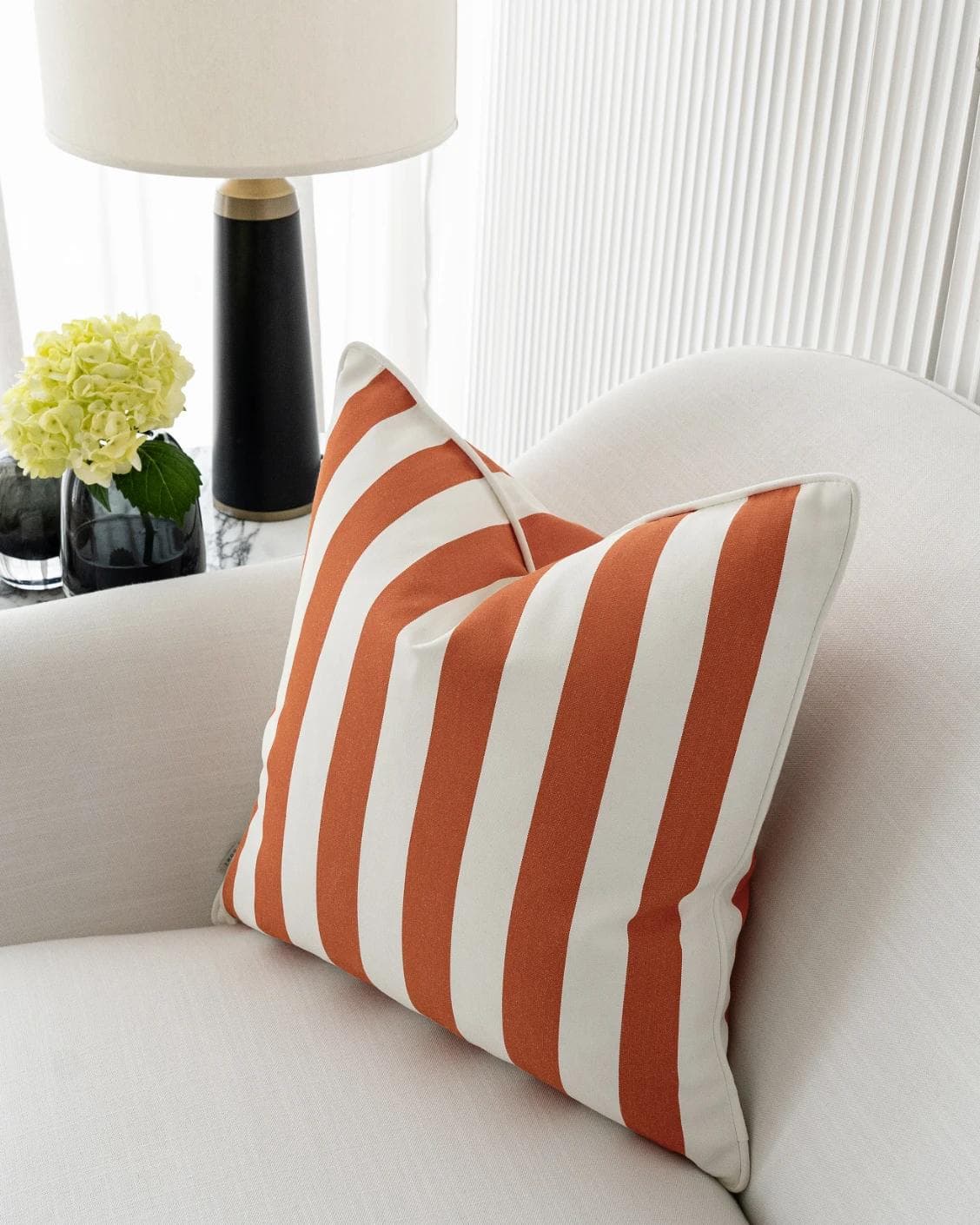 Aelia Coral cushion in orange, shown in a lifestyle right view as image 6