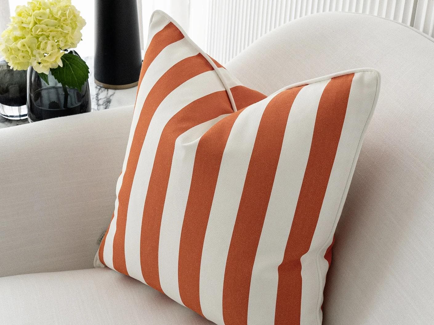 Aelia Coral cushion in orange, shown in a lifestyle right view as image 6