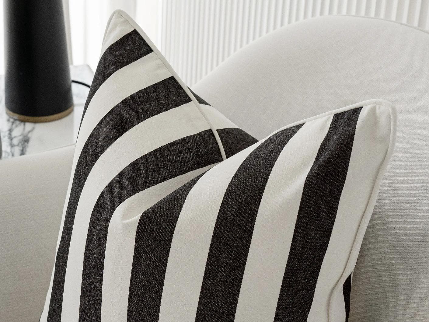 Aelia Ebony single - outdoor in black, shown in a lifestyle right view as image 1